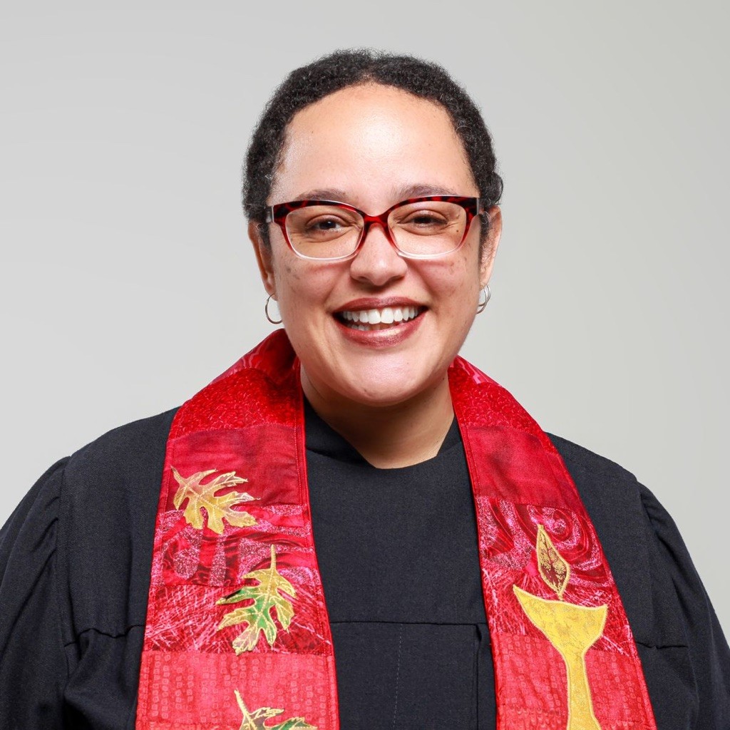 Image of Sofia Betancourt in a red clergy stole over a black shirt